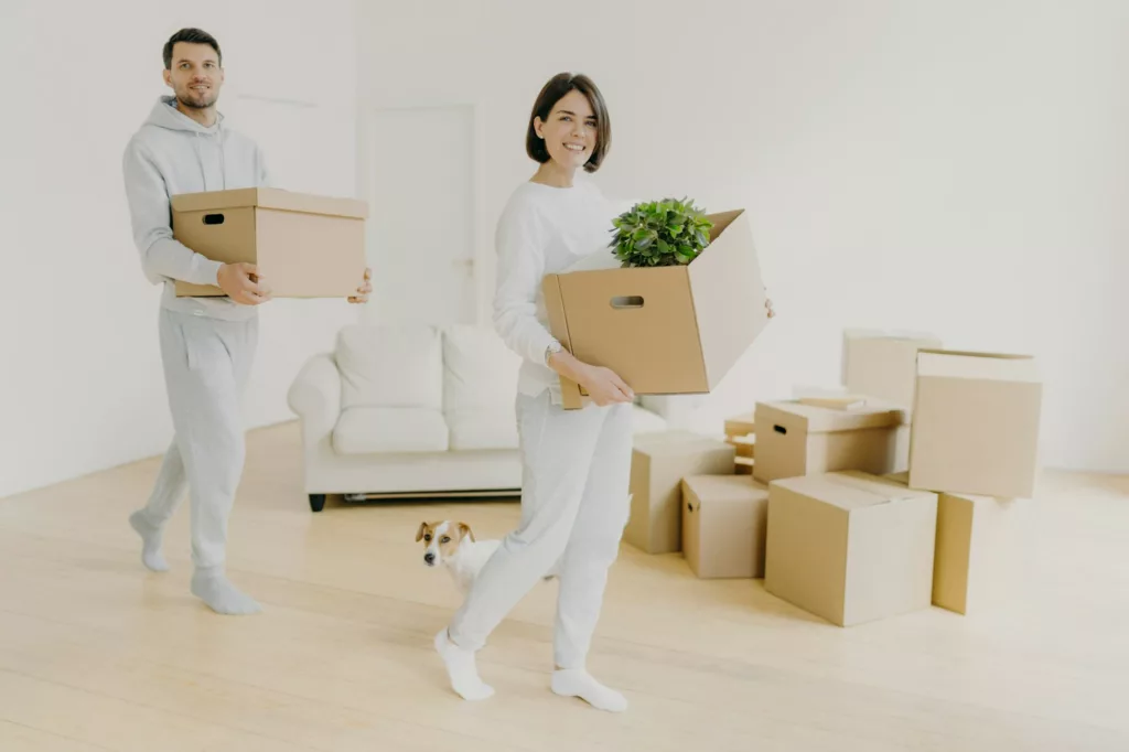 Horizontal shot of happy young couple move in new home, buy real estate
